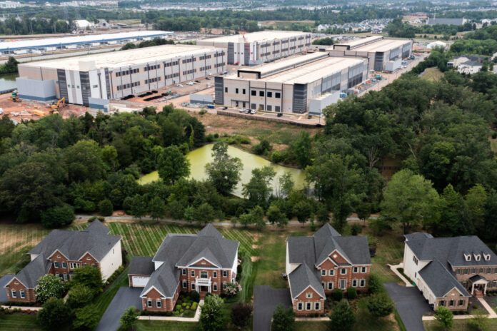 An aerial view shows a data center situated near single-family homes in Stone Ridge, Va., in 2024. (Photo by Nathan Howard/Getty Images)