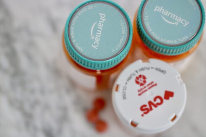Photo illustration of prescription medicine in bottles. (Photo by Charlotte Rene Woods/Virginia Mercury)