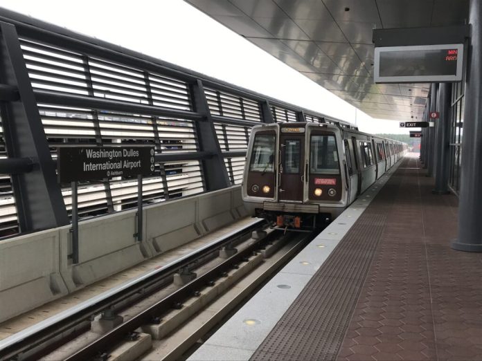A Metro railcar pulls up to the Dulles International Airport Metro Station. (Photo by Tim Walck/Dulles Corridor Metrorail Project)