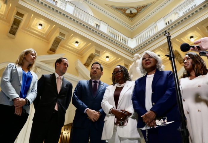 Members of Virginia's Senate Finance and Appropriations Committee speak with the press in the Capitol Rotunda on June 22, 2026. The legislature advanced a $205 billion, two-year spending plan the same day. (Photo by Charlotte Rene Woods/Virignia Mercury)