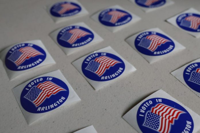 Stickers in Arlington County in June 2025. (Photo by Nathaniel Cline/Virginia Mercury)