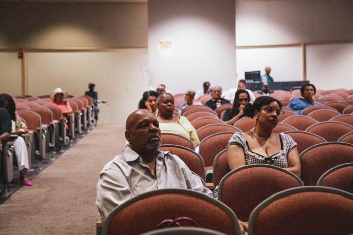 Attendees listen during the commission's June public listening session. (Photo by Marcus Ingram/Virginia Mercury)